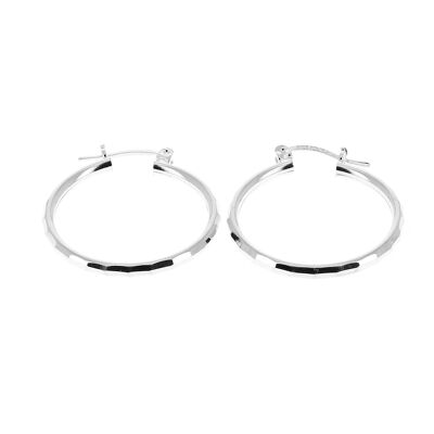 Small silver hoop earrings chiseled with rectangles