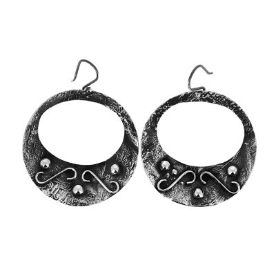 Round and decorated partially blackened silver earrings