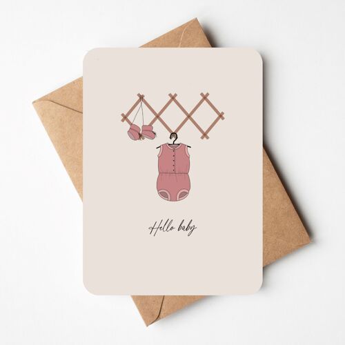 Greeting card with pink romper suit
