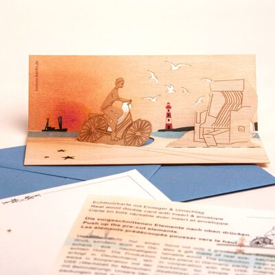 Bicicleta junto al mar - tarjeta de felicitación de madera con motivos emergentes