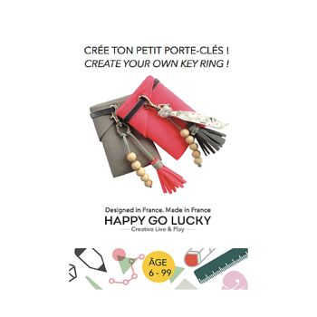 Kit créatif  "Crée ton porte clés". Pochette grise et pompon rose 4