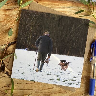 Follow Me - man and dog in snow Greeting card