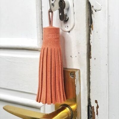 Tassel keychain in coral suede