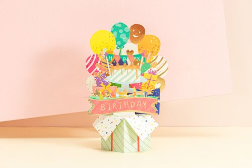 Pop-up verjaardagskaart vol cadeautjes in doos, ballon en confetti