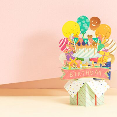 Biglietto di compleanno pop-up pieno di regali in scatola, palloncini e coriandoli