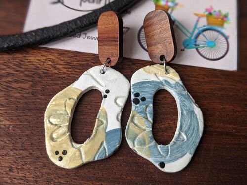 Abstract embossed earrings with blue and yellow flowers and a wooden stud, floral air dry clay earrings, summer earrings