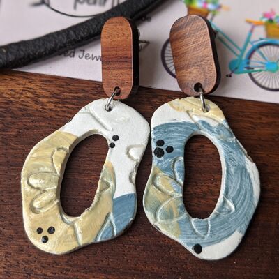 Abstract embossed earrings with blue and yellow flowers and a wooden stud, floral air dry clay earrings, summer earrings