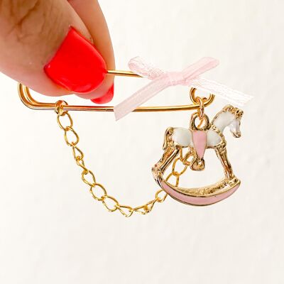 Pin lucky charm for baby girls as a gift for birth, rocking horse pink