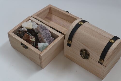 Treasure box with raw gemstones mix