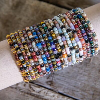 Ladies bracelets glass bead bracelets on a wooden roll
