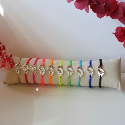 Cushion with 10 handcuff bracelets on cord