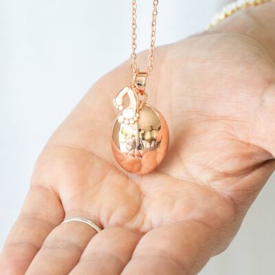Pink gold egg pregnancy bola with little feet pendant