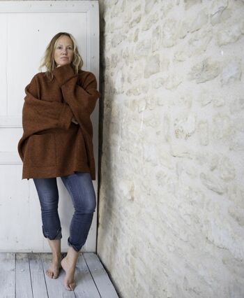 Oversized terracotta poncho sweater with pockets 1