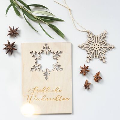 Christmas time postcard with hanging snowflake