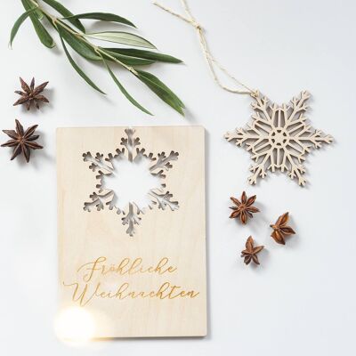 Christmas time postcard with hanging snowflake