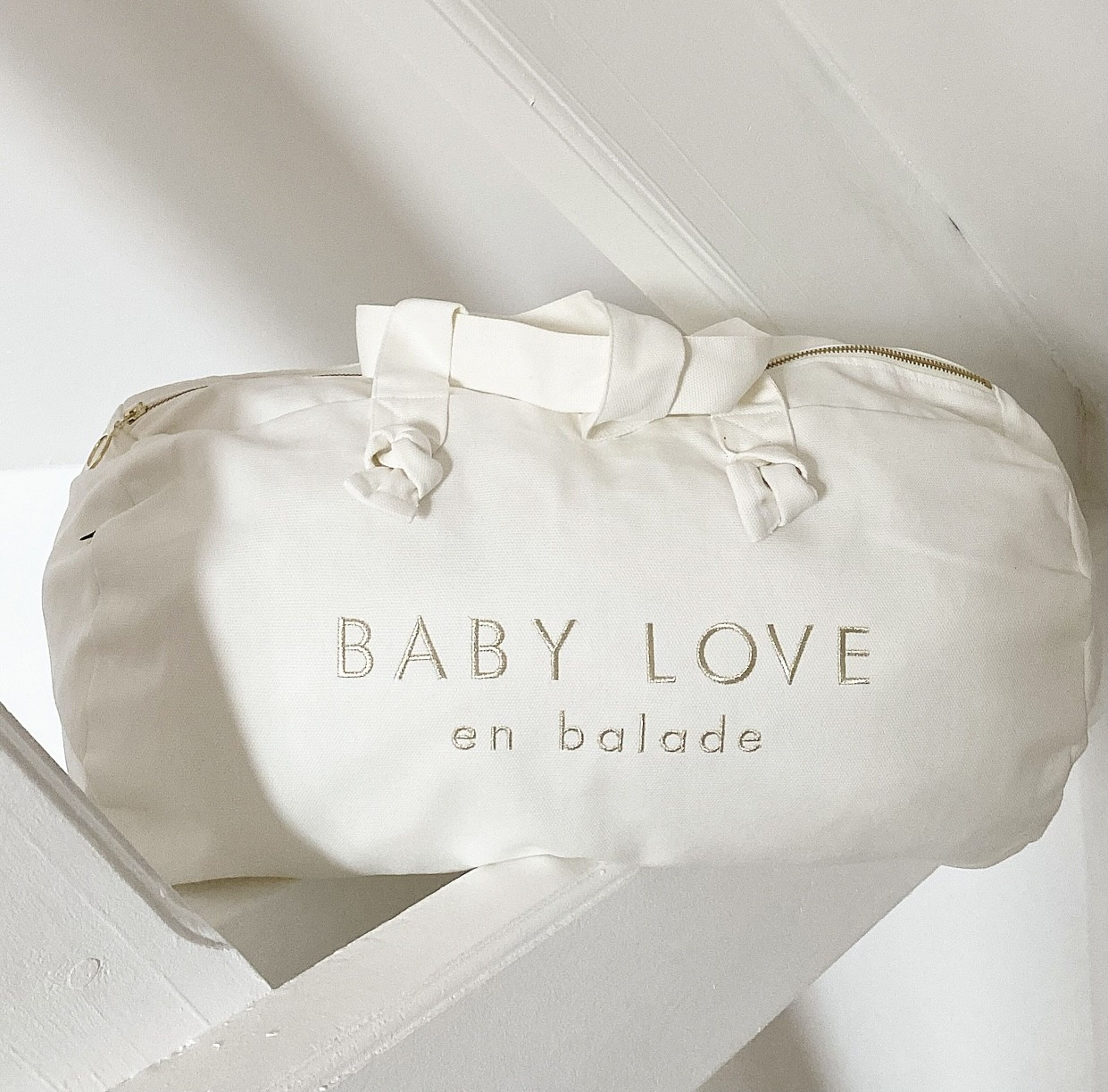 Buy wholesale Milk White Embroidered Duffel Bag - Baby love on the go