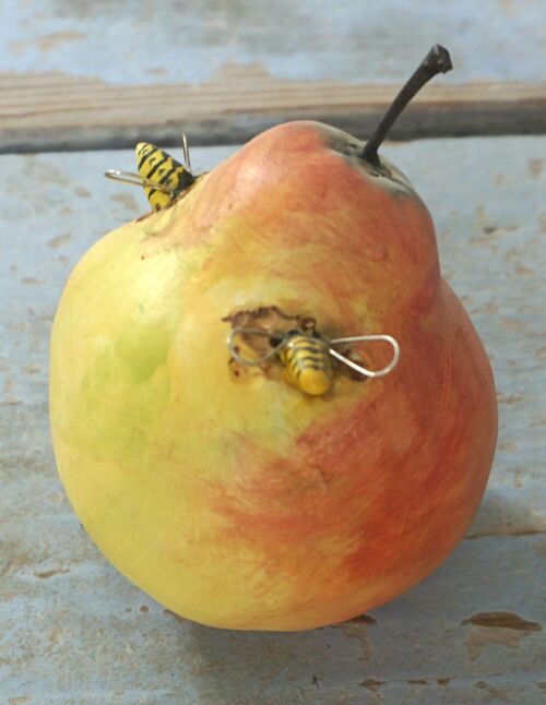A Pottery Pear with wasp with silver wings
