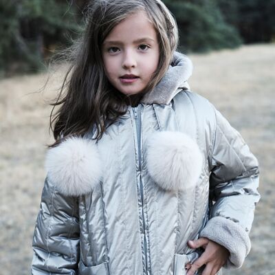 TILO: Taupe padded coat with hood and natural fur pom-poms.