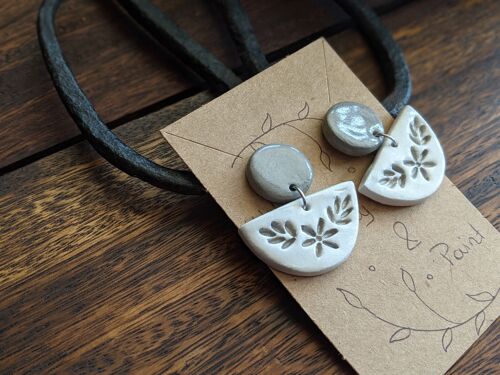 white embossed earrings with a grey stud