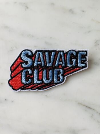 Broche tissée Savage Club 2