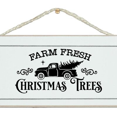 Granja árboles de Navidad frescos. Signo de Navidad de la vendimia