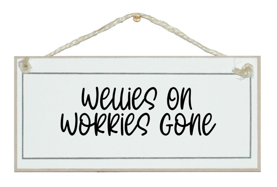 Gummistiefel an, Sorgen weg. Schild