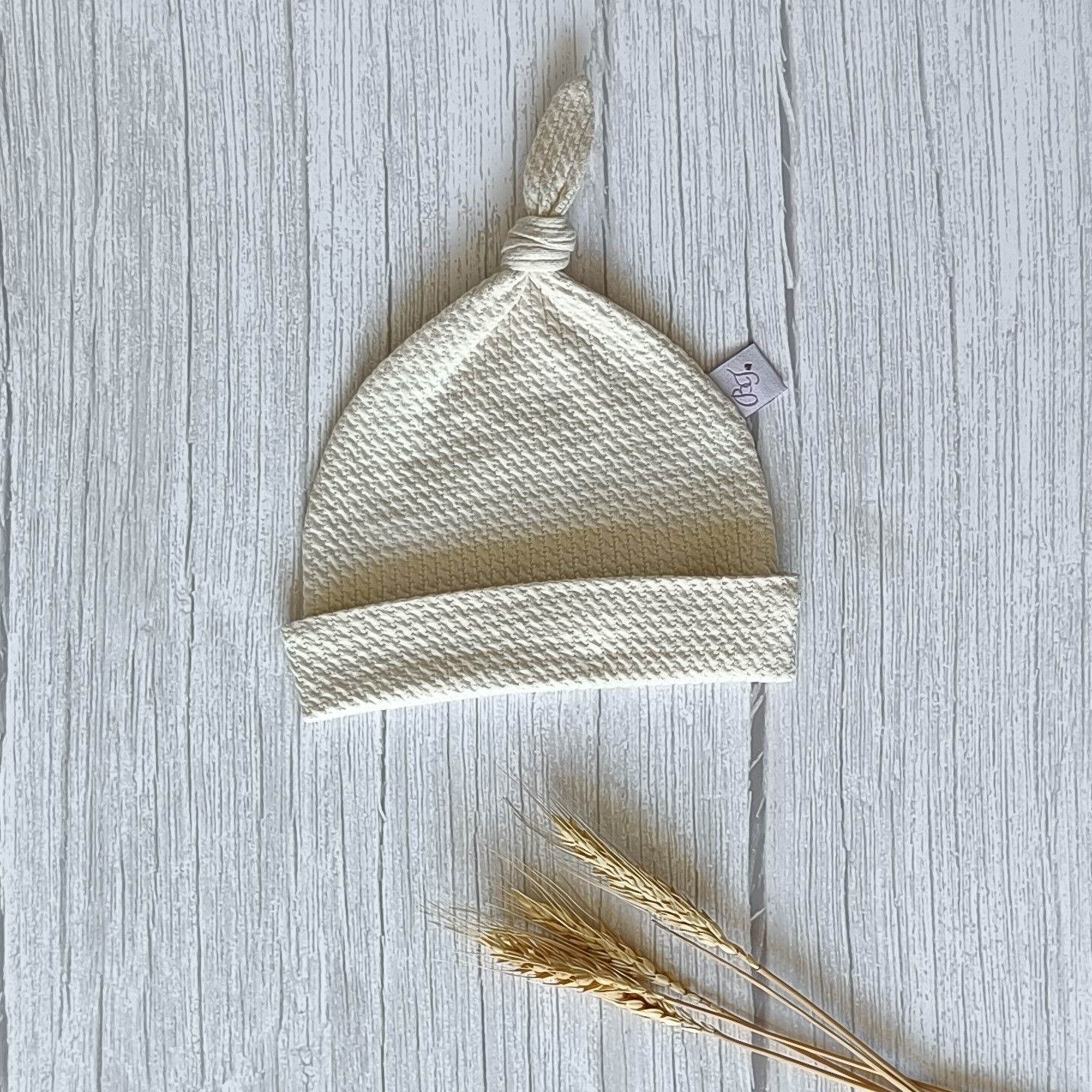 Knopfmütze gewellt natur