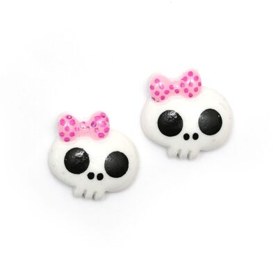 Boucles d'oreilles clips tête de mort baby doll blanche avec noeud