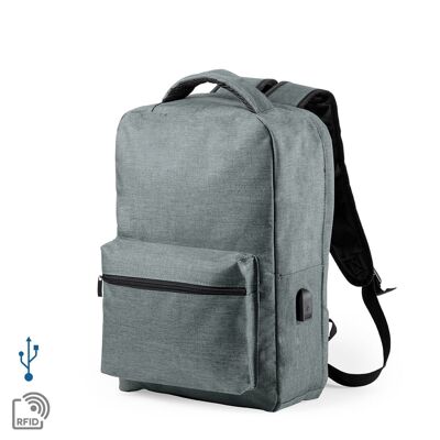 Mochila antirrobo Komplete de poliester 300D, con toma USB exterior. Bolsillo en lateral con protección RFID. Gris