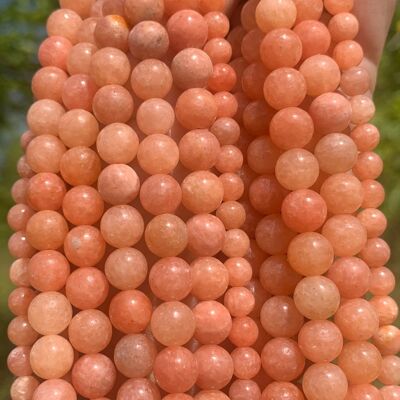 Perles en calcite orange entre 6 et 8mm - 6mm