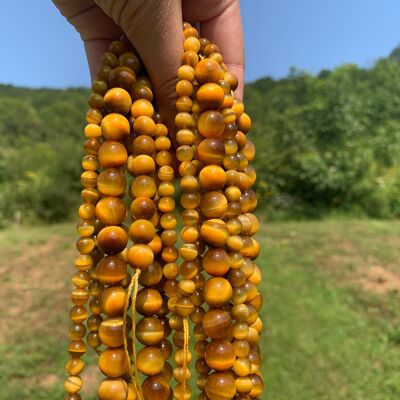 Perles en oeil de tigre doré / jaune entre 6 et 10mm - 10mm