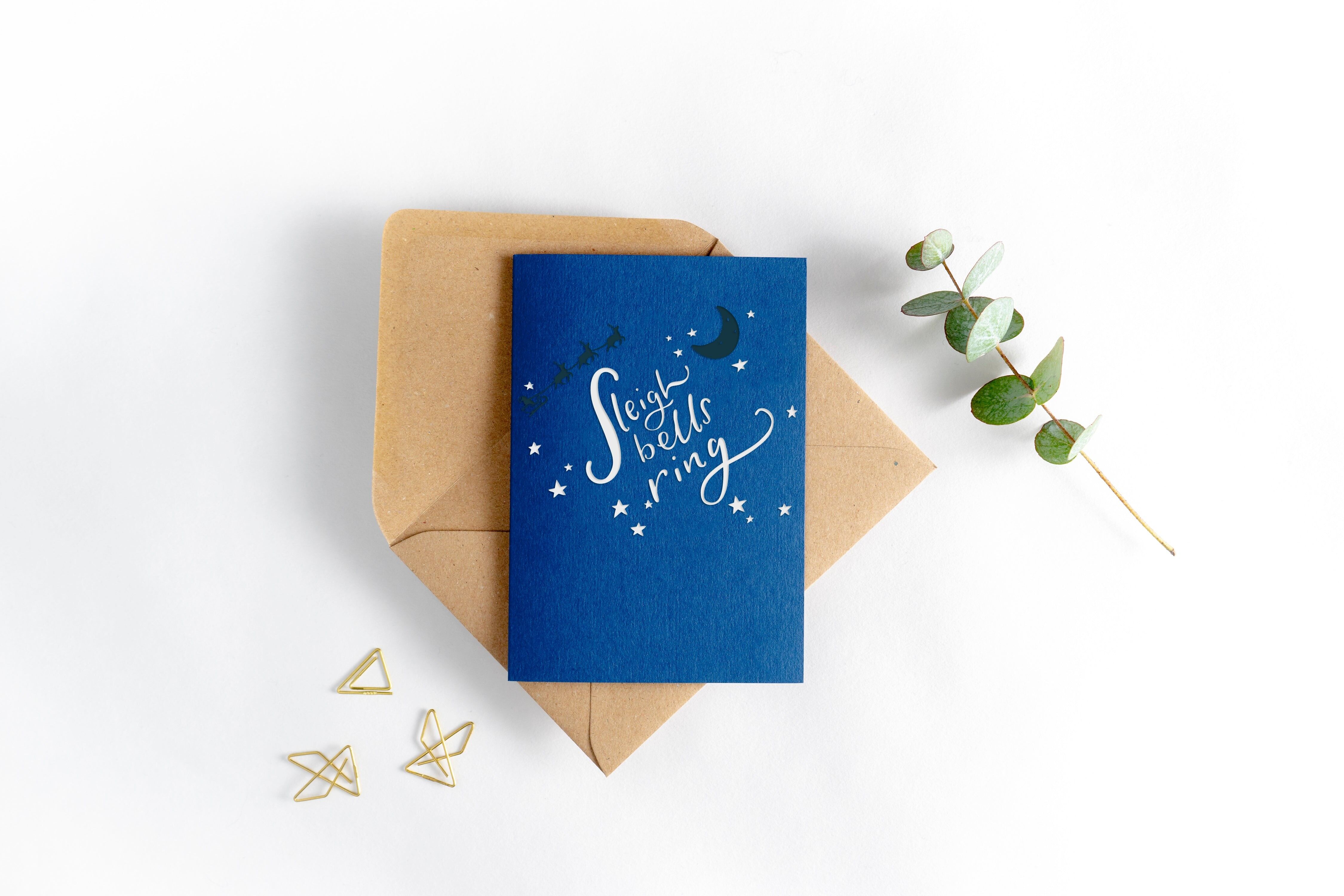 Cartolina di Natale tipografica con anello di campane a slitta