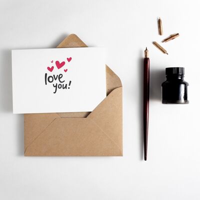 Te amo corazones tipografía tarjeta
