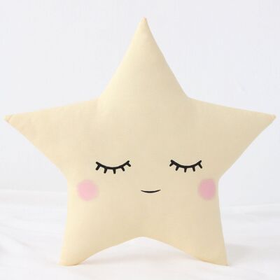 Cuscino a forma di stella giallo pastello assonnato con guance rosa
