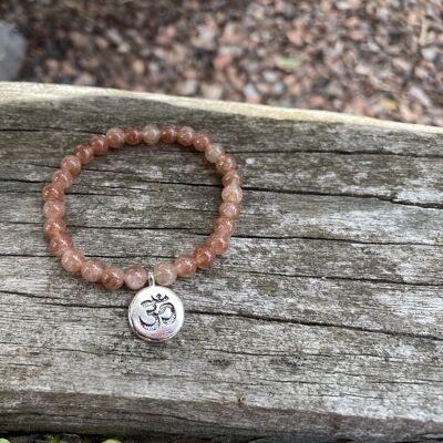 Lithotherapy elastic bracelet in natural Sun stone OM sign charm