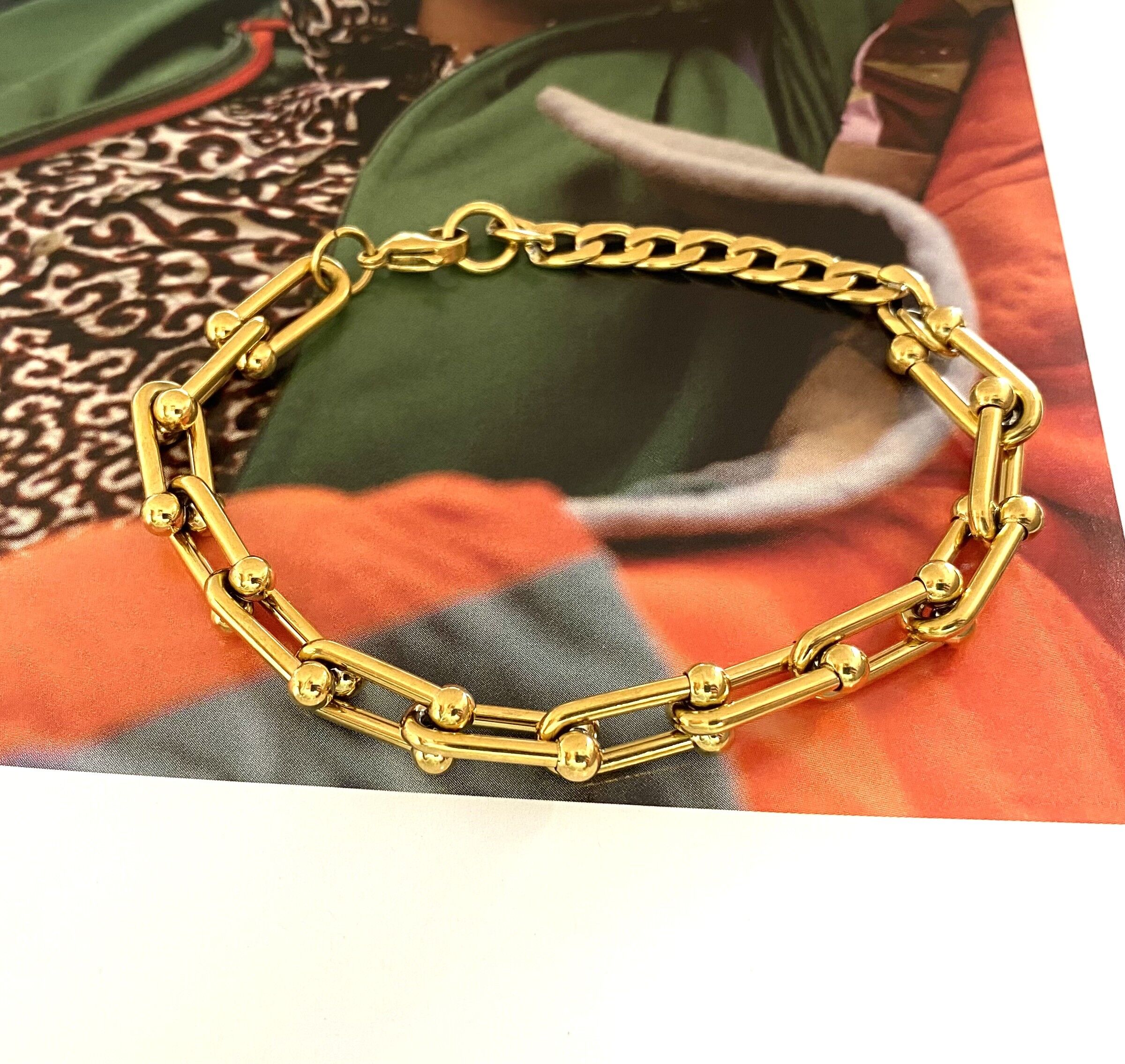 Bracciale staffa in acciaio inox oro
