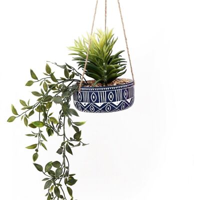 Maceta colgante de cerámica azul con plantas