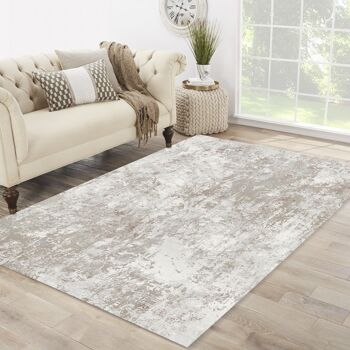 Tapis design motif abstrait moderne beige rose