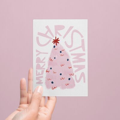 Tarjeta navideña con abeto rosa e inscripción Feliz Navidad