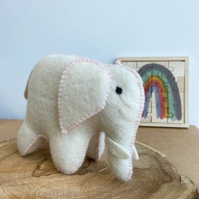 White and pink felted wool elephant