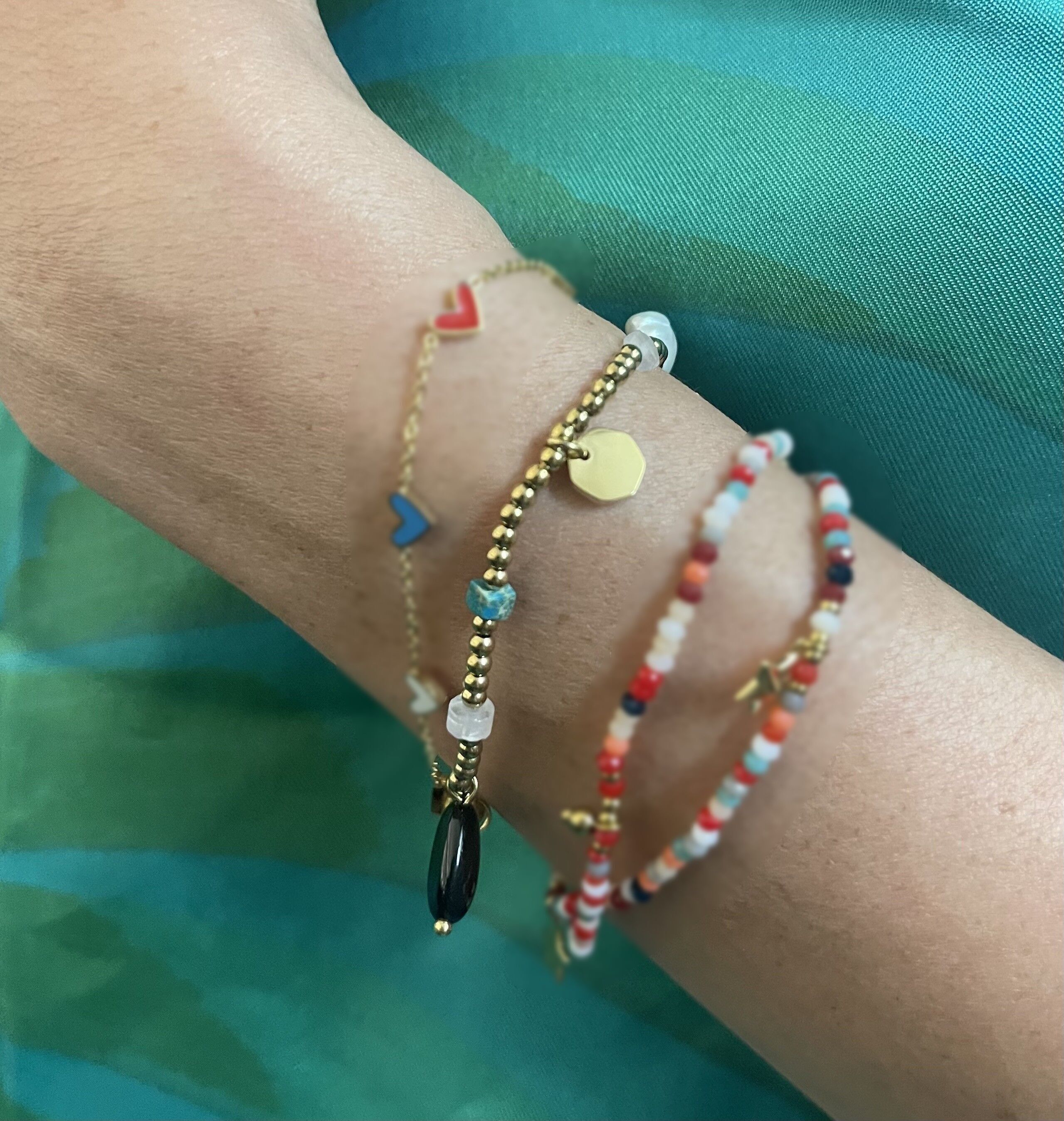 Steel bracelet with round beads and stones of different shapes