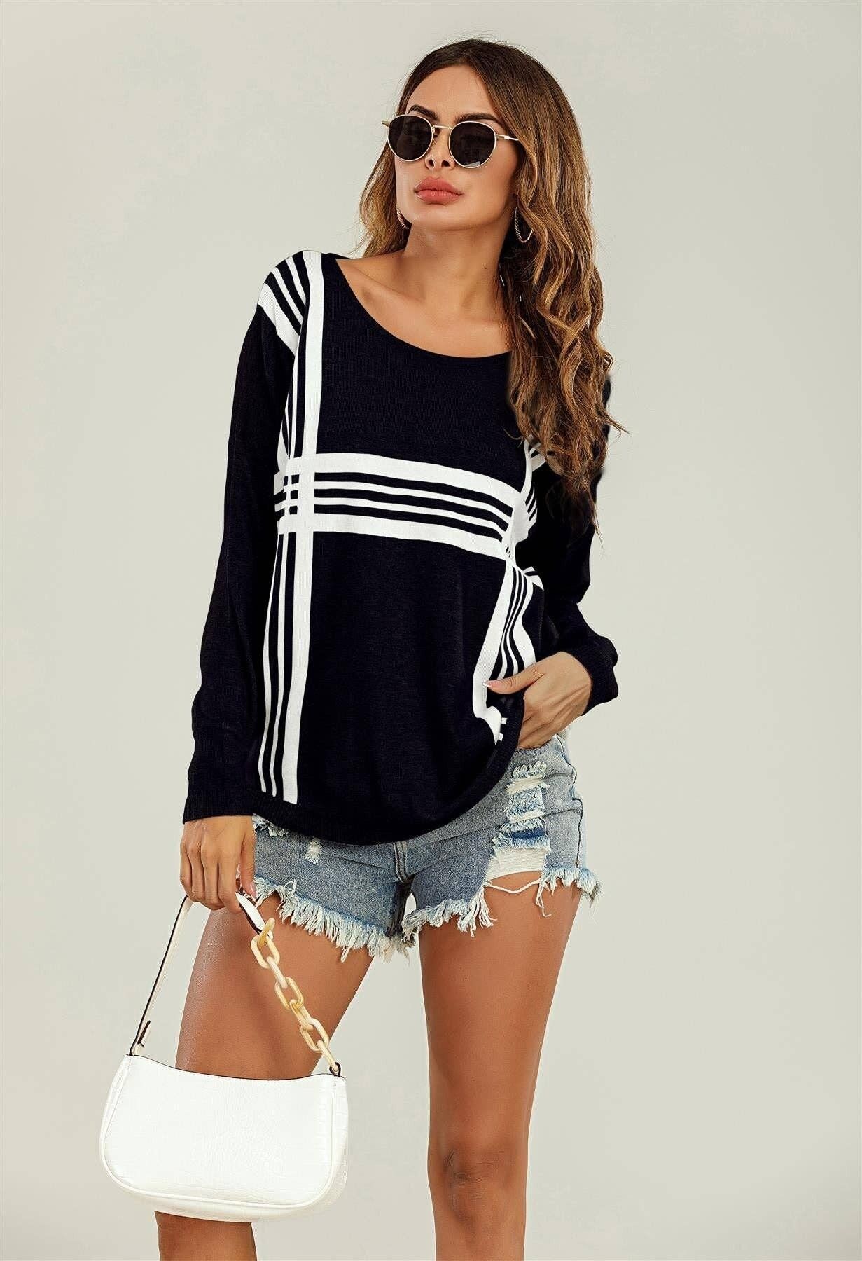 Maglia nera Top a righe bianche