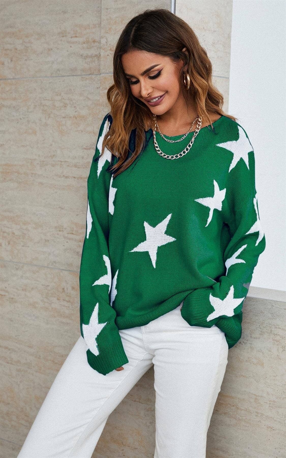 Simpatico maglione bianco con motivo a stella in verde bosco