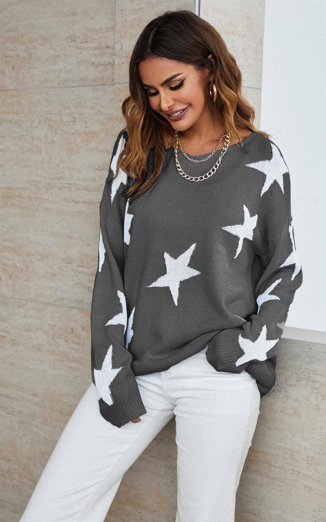 Simpatico maglione bianco con motivo a stella in grigio