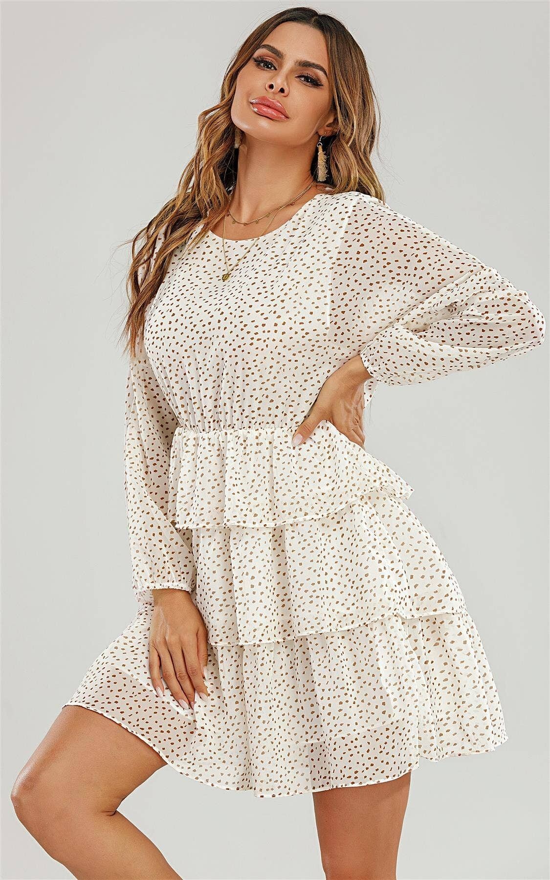 Mini robe en mousseline à volants à manches longues à pois blancs