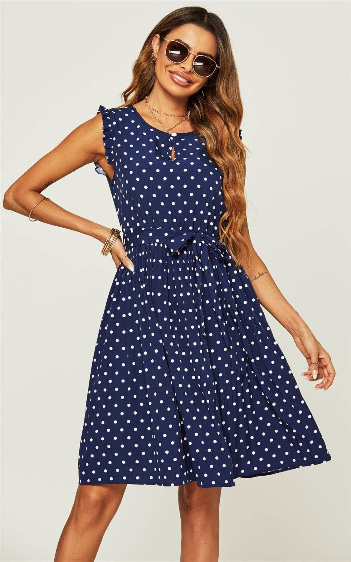 Robe mi-longue à pois et à volants en bleu marine