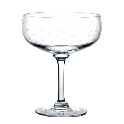 Un set di quattro bicchieri da cocktail in cristallo con design a stelle