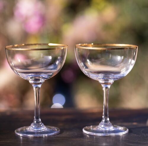 A Set of Six Crystal Champagne Saucers with Gold Rim Design