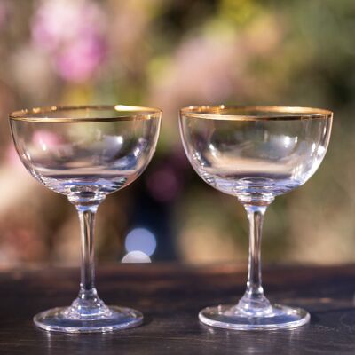 A Set of Six Crystal Champagne Saucers with Gold Rim Design