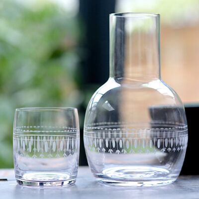 A Crystal Carafe Set with Ovals Design